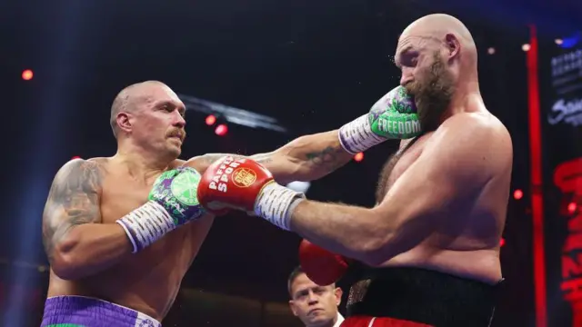 Oleksandr Usyk punches Tyson Fury