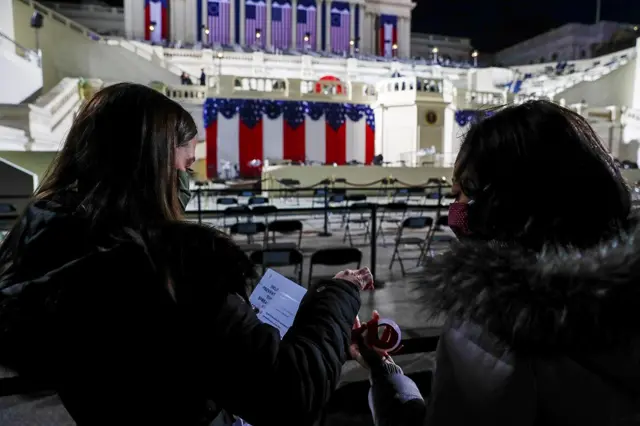 Staff members put out Covid information signs