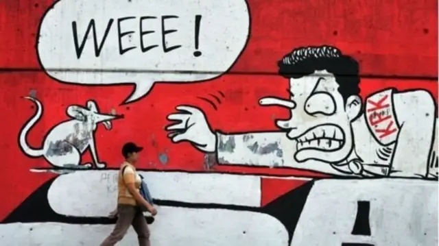 Lukisan mural yang menggambarkan upaya memerangi praktik korupsi di Indonesia.