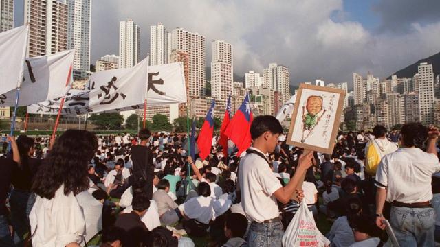 JUNE 4: Up to 500,000 people shown in file photo dated 04 June 1989 filling the Happy Valley racetrack in Hong Kong to protest the army crackdown in Beijing that claimed hundreds of lives. (Photo credit should read GEORGES BIANNIC/AFP via Getty Images)