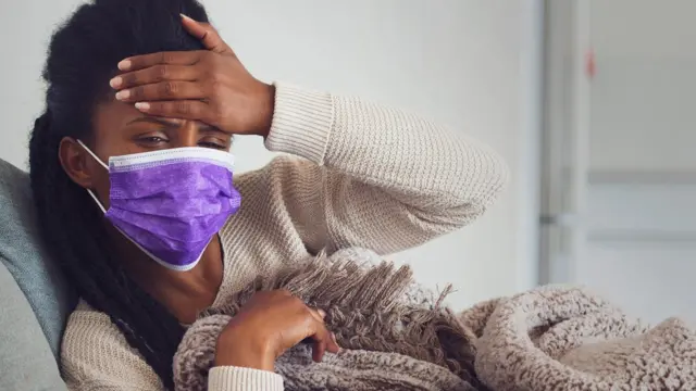 Woman with a purple face mask