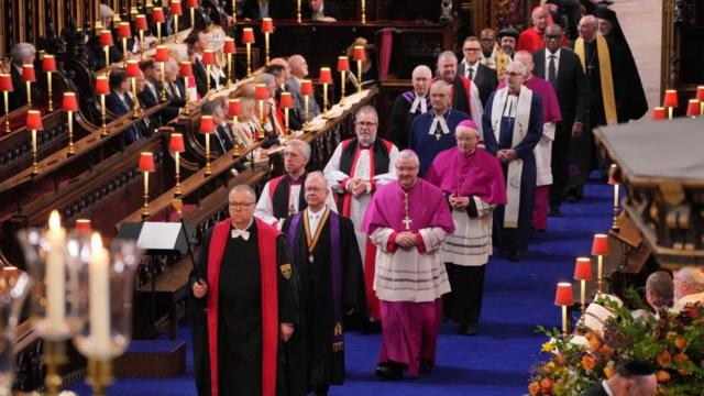 Faith leaders and faith representatives in the procession through Westminster Abbey ahead of the coronation ceremony of King Charles III and Queen Camilla in London