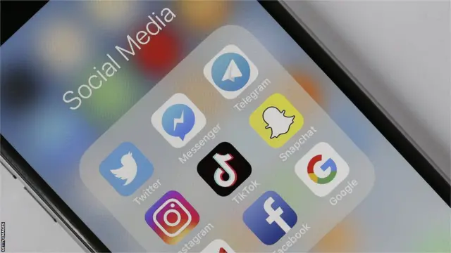 Social media icons on a mobile phone screen