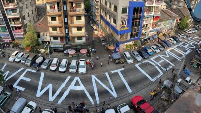 "We want democracy" is written on the streets of Yangon, Myanmar