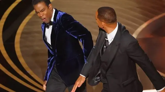 Chris Rock yateye urwenya ku mugore wa Will Smith undi araza amwasa urushyi