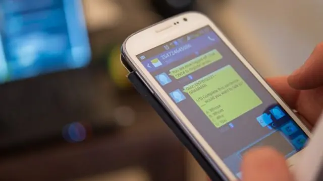 Person dey chat for phone