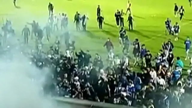 Large crowds on a football pitch