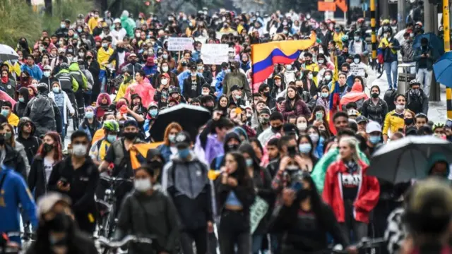 Demonstrators take part in a protest against a tax reform proposed by Colombian President Ivan Duque's government in Bogota, on 4 May