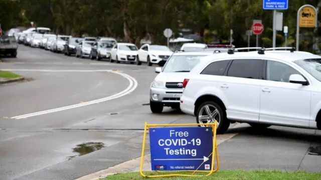 Cars queue for drive-thru Covid-19 testing in Sydney, Australia