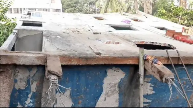 বাবুরাইল এলাকায় ধসে পাশের একটি খালে গিয়ে পড়ে এই ভবনটি
