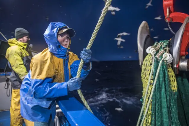Two fishermen on board the Guardian Angell boat in the Shetlands