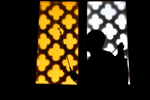 A man spray disinfectant in the mosque before opening them in front of worshipers, according to the decision of the Egyptian government, Egypt, Cairo, June 27, 2020