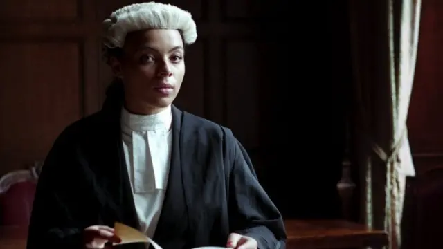 Alexandra Wilson wearing her wig and gown