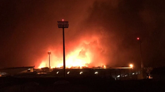 A photo showing fires approaching CD Tondela's stadium