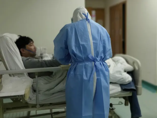Hospital bed with patient
