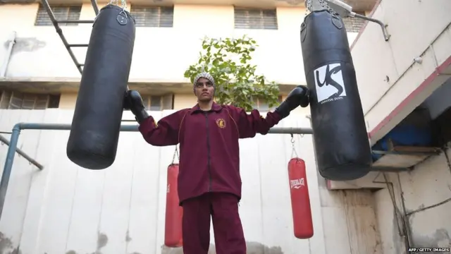 Razia Banu, 20, a Pakistani female national boxing champion, poses for a picture before a practice session at a boxing club in Lyari, Karachi's most restive -- and sporty -- neighbourhood, on February 20, 2018.