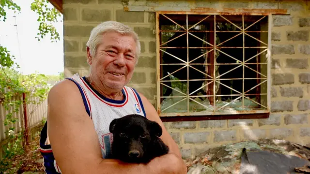 Sergiy et son chien, Mukha