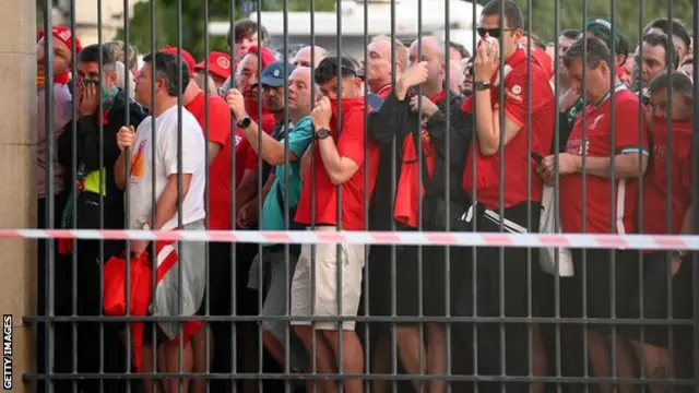 Fans queueing outside the stadium