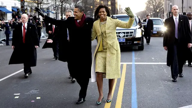 Michelle and Barack Obama walking through Washington DC at his inauguration in 2009