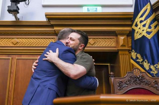 The leaders of Poland and Ukraine embraced in the chamber earlier today