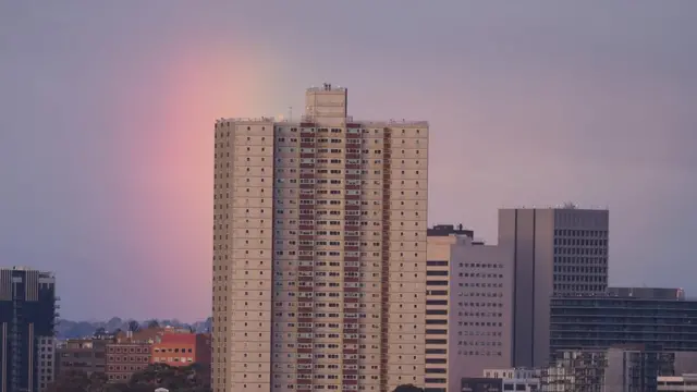 A building in front of the sunrise