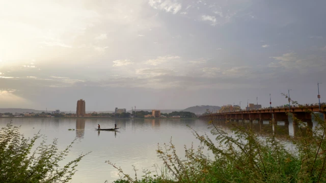 Men fishing off a boat on the River Niger in Bamako, Mali - Tuesday 25 May 2021