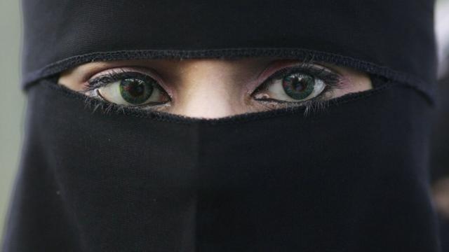 A woman wearing a niqab veil