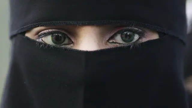 A woman wearing a niqab veil