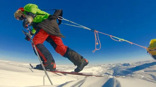 O'Brady dragging a heavy sled