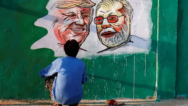 Slum residents hidden away by India's newly built wall are afraid of becoming permanently invisible