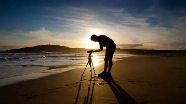 Fotógrafo con trípode