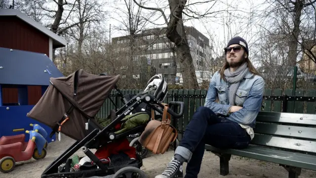 Man for park with pikin stroller