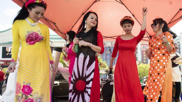 Singers with the band, The Angel Band, sing during the Lunar New Year Celebrations at the Asian Garden Mall in Westminster on Tuesday, February 5, 2019