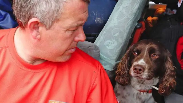 Gary Carroll with his search and rescue dog