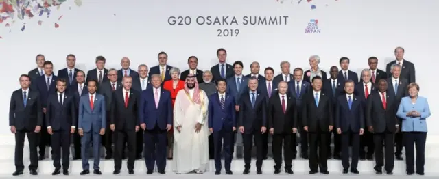 G20 family photo - wit Saudi Arabia's Crown Prince Mohammed bin Salman for middle