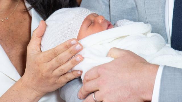 Prince Harry and Meghan, Duchess of Sussex are seen with their baby son, who was born on Monday morning, during a photocall in St George"s Hall at Windsor Castle, in Berkshire
