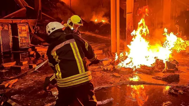 Emergency services work to control fire at business centre and warehouse in Odesa