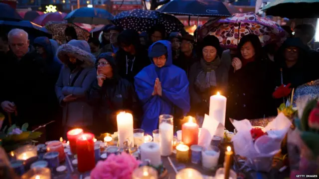 People pray for the victims of the mass killing at a vigil on April 24, 2018 in Toronto, Canada