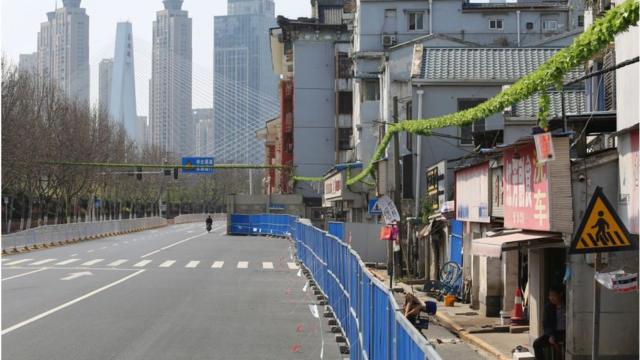 March 17, 2020 shows a barrier set up to prevent people from entering or leaving a residential community in Wuhan, in China's central Hubei province.
