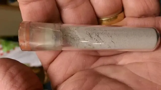 This small sample of lunar dust was collected by Neil Armstrong, the first human to walk on the Moon, on July 20, 1969.