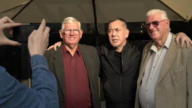 Athony Wong and brothers taking pictures