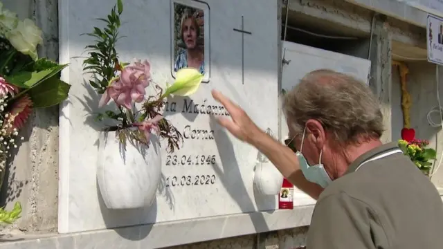 Man visiting grave