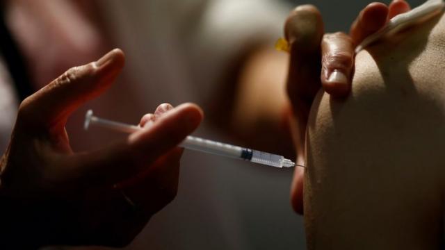 A medical worker administers a dose of Covid vaccine in Nantes, France, September 14, 2021.