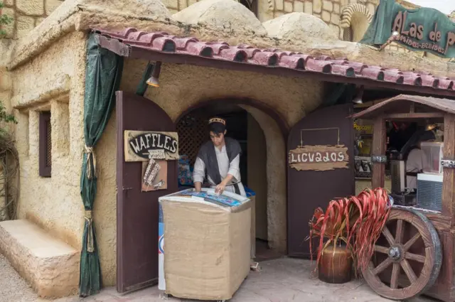 A member of staff selling snacks