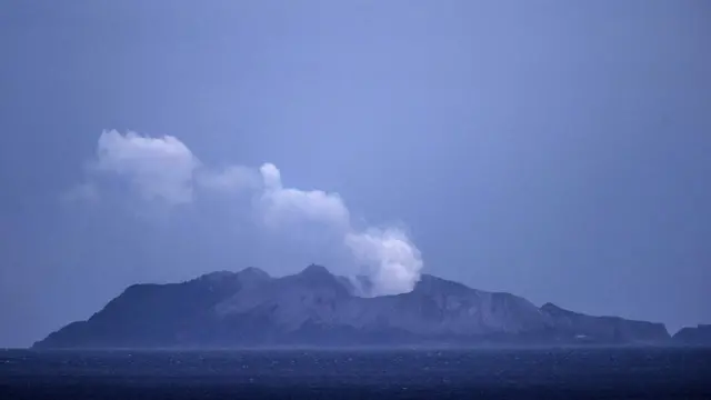 Smoke and ash rises from a volcano on White Island early in the morning on December 9, 2019 in Whakatane, New Zealand