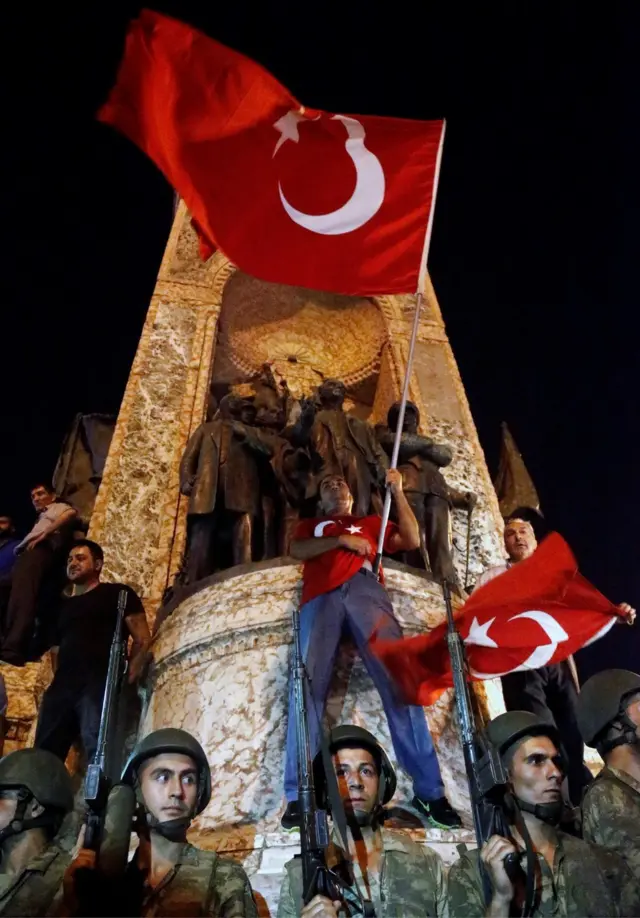 Turkish soldiers guard at the Taksim Square in Istanbul