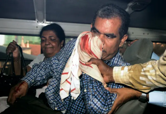 Sri Lankan chief editor of the privately-owned Rivira weekly Upali Tennakoon is rushed to the Colombo national hospital on January 23, 2009. Unidentified assailants stabbed him and smashed his car as he drove to work with his wife, Dhammika who was also injured. AFP PHOTO/Ishara S. KODIKARA (Photo credit should read Ishara S. KODIKARA/AFP via Getty Images)