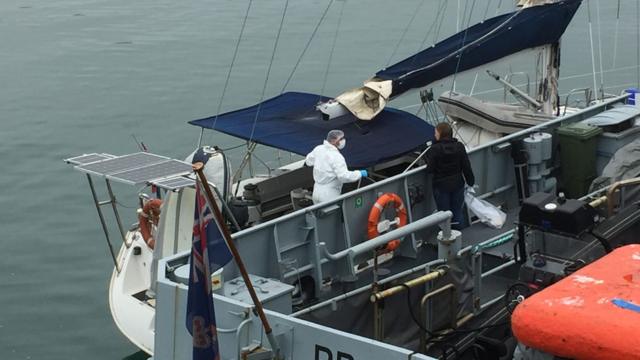 Drugs officers searching the yacht