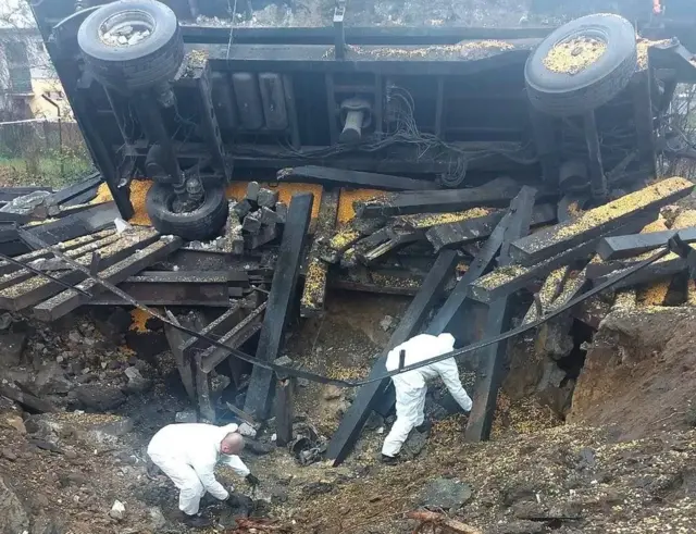 Forensic personnel working at the explosion site in Poland