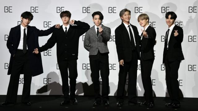 BTS members pose for a photo session in Seoul in November